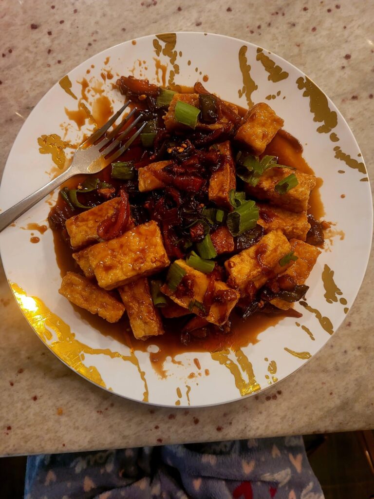 Battered fried tofu in a brown sugar soy sauce.