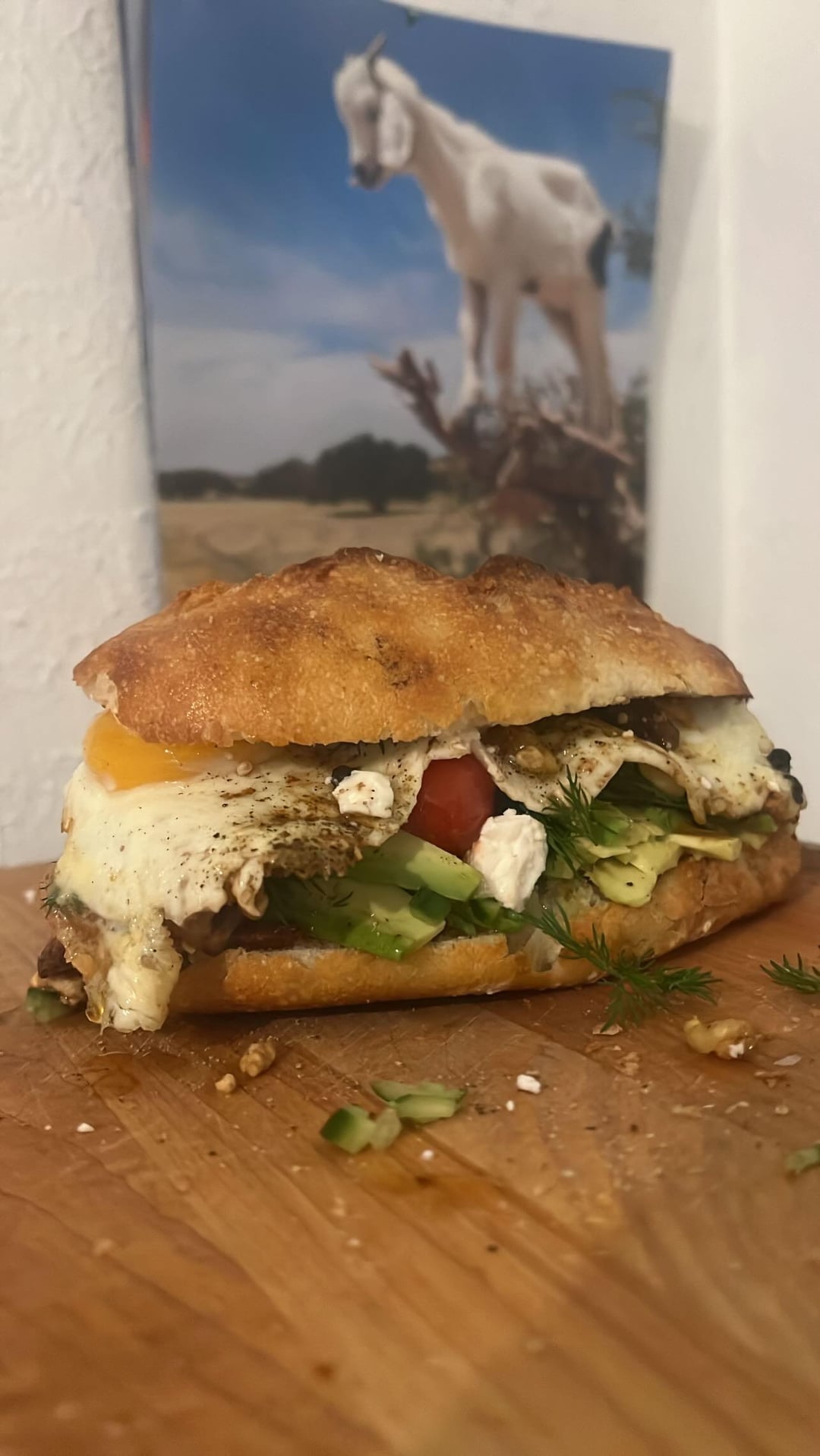 Breakfast sandwich on bacon lardon and Gruyère bread with dressed