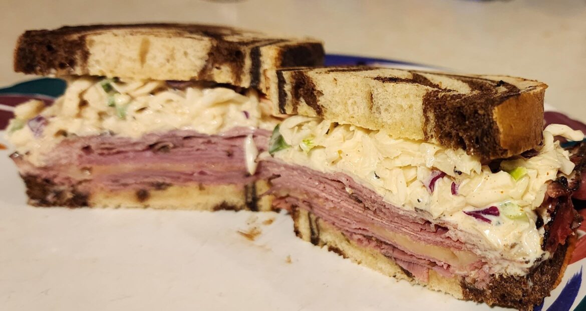 Lunch today is Pastrami, Carolina reaper cheese, marble rye, and homemade jalapeño coleslaw.