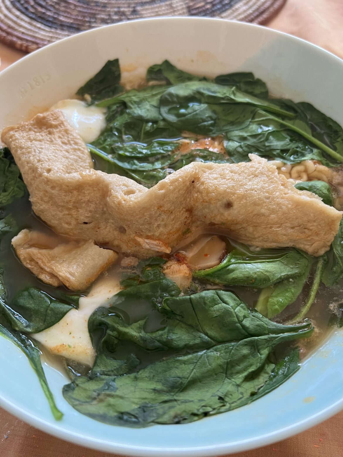 Elevated my shin ramen with eggs, fish cake and spinach