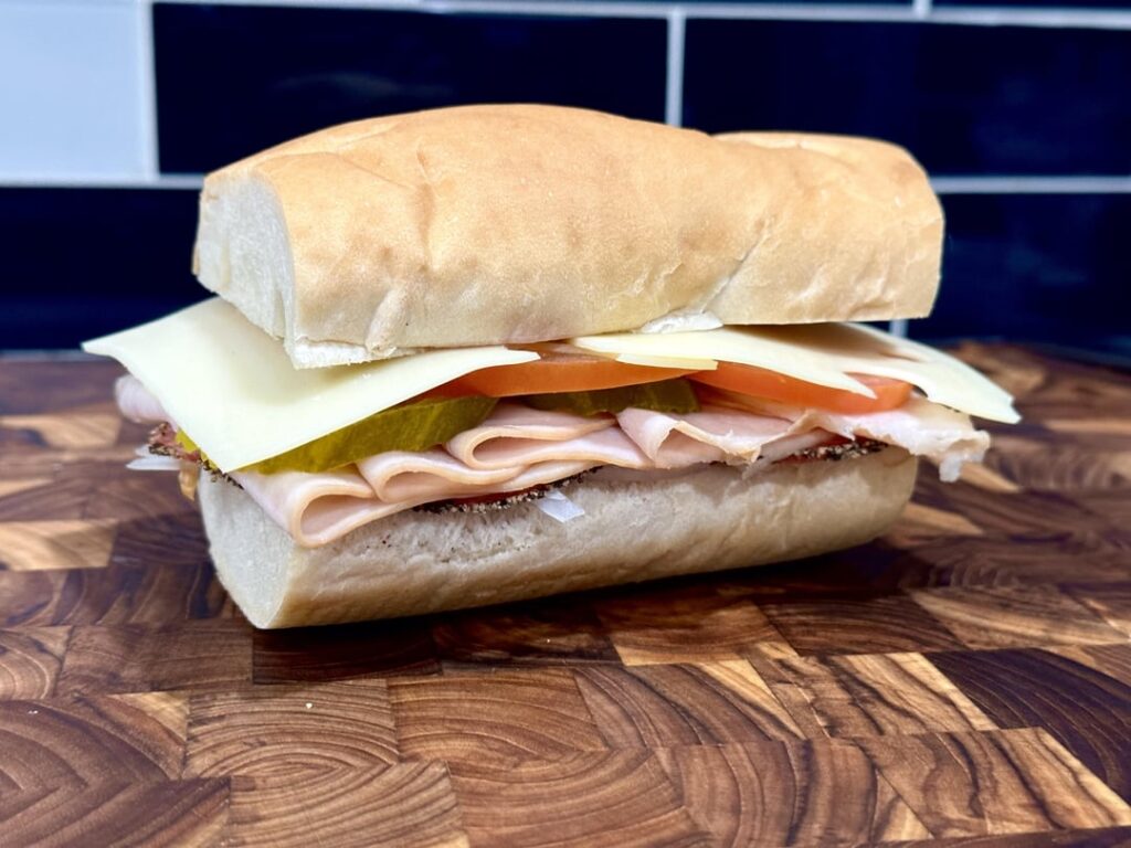 peppered salami, turkey and swiss w/ mayo, deli mustard, pickle, onion and seasoned tomato.