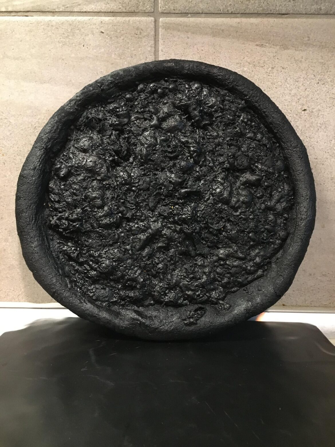 Literal charcoal pizza