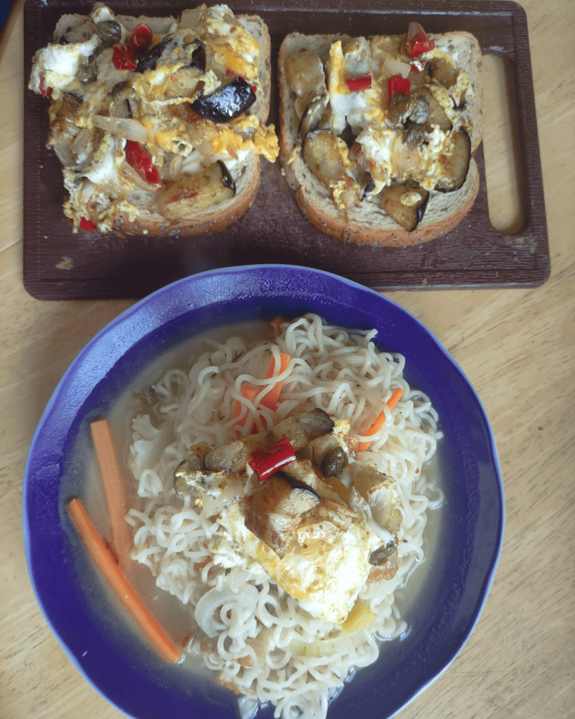 Quick and easy breakfast. Sandwich with fried eggplant and eggs with capers and noodles with egg on top.
