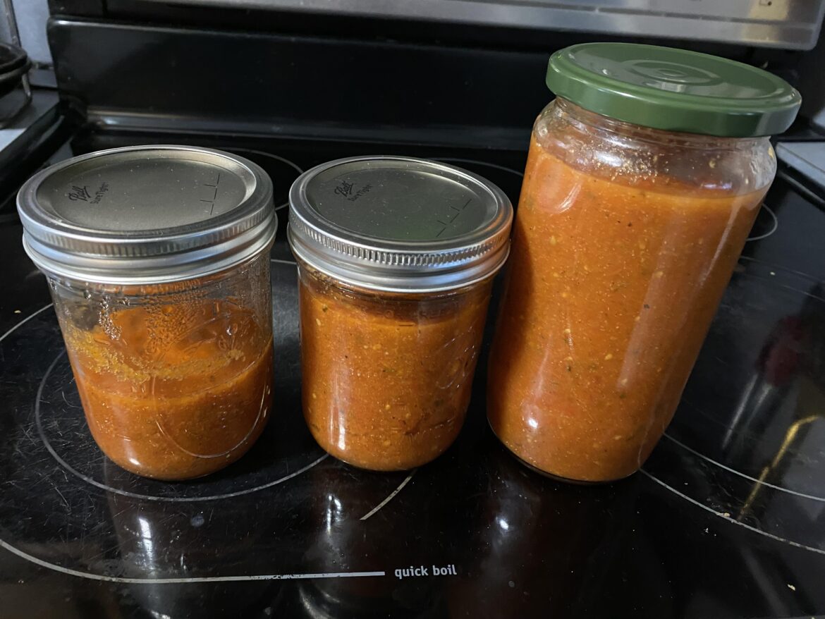 Would having this much air space cause any issues with preservation? And is reusing old store bought sauce jars safe? The top sucked down.