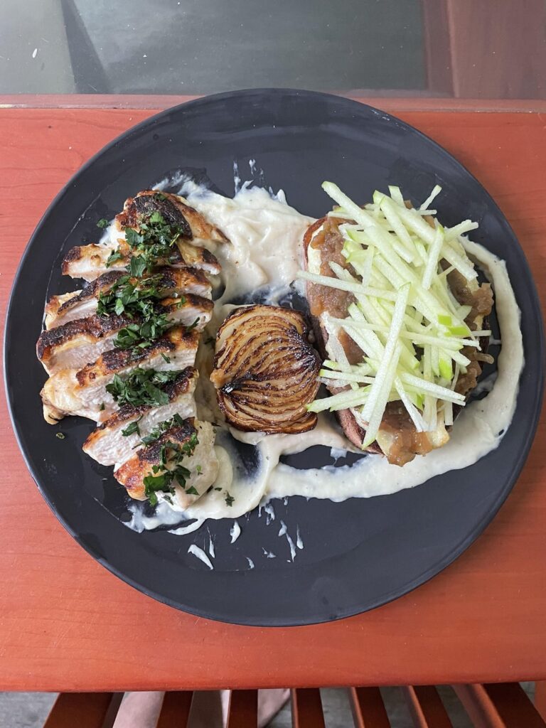 Crispy skin chicken, parsnip cauliflower brown butter purée, brie toast with apple onion jam and fresh apple