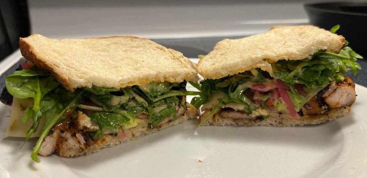 Chicken thighs, chipotle aioli, pepper jack cheese, avocado, pickled onion, spinach, and arugula on toasted sourdough.