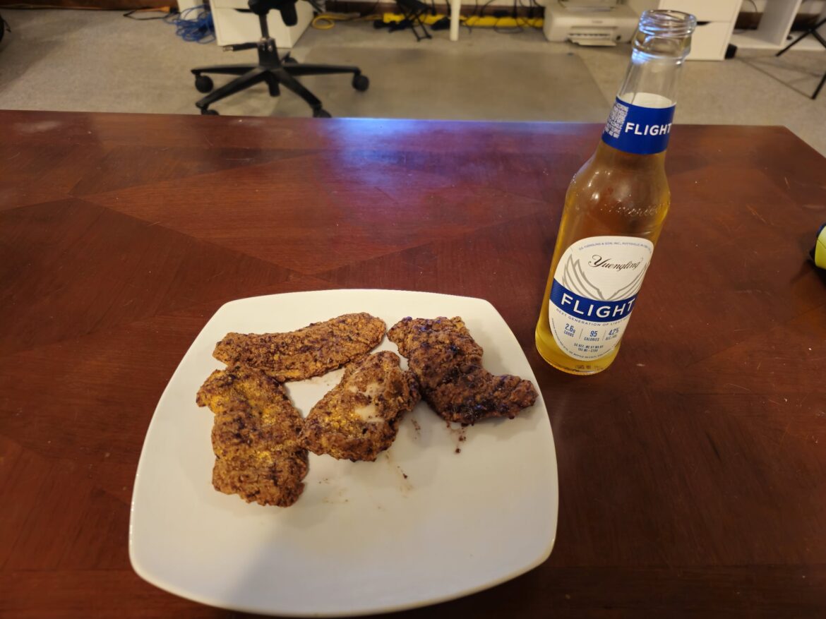 Chicken strips tossed in Bravado Ghost Pepper and Blueberry Hot Sauce and a nice adult bev to wash it down with. Bon Appétit