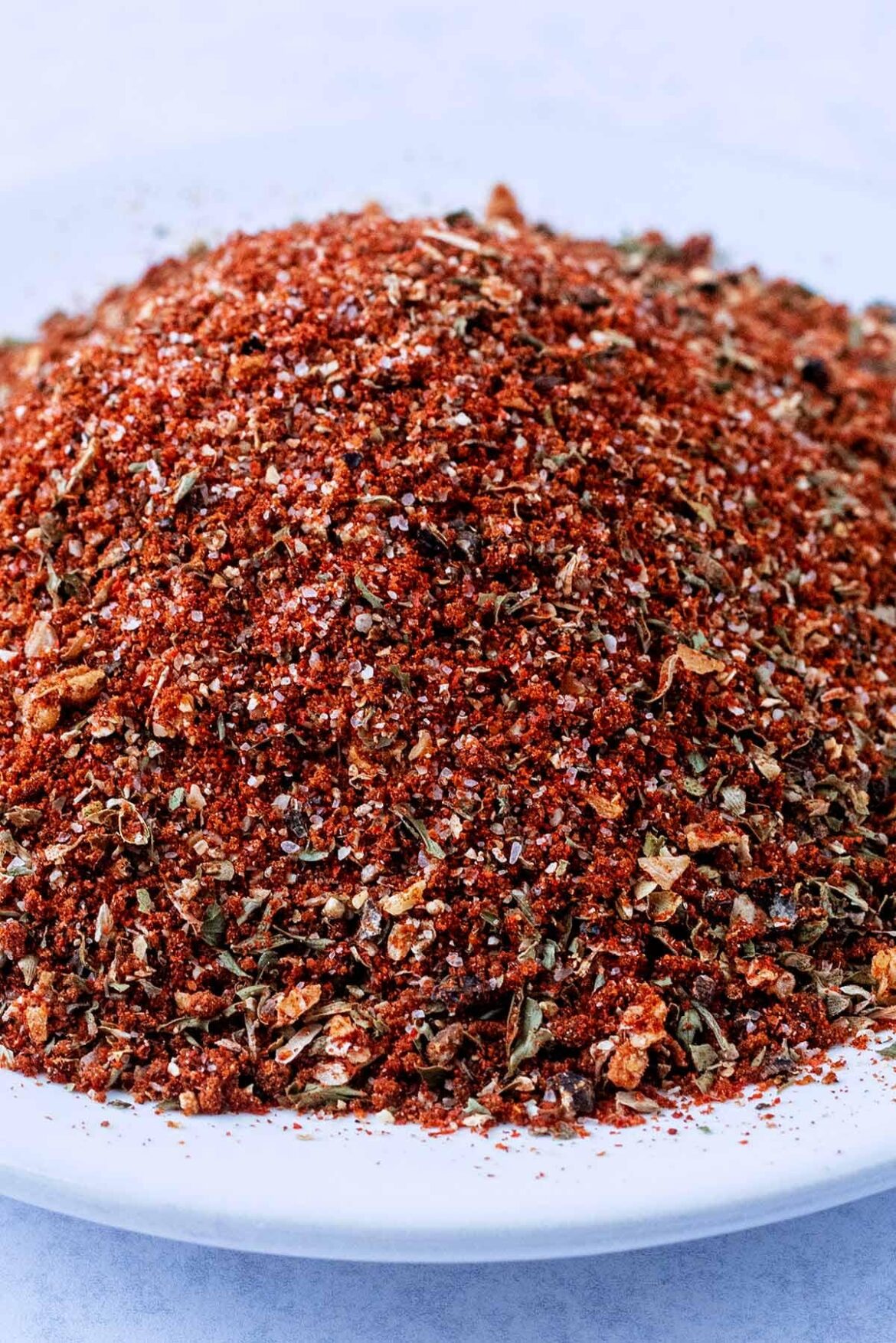 Peri Peri Seasoning. I use it on Fries, Pizza and burgers. Not super hot but great pepper mix.