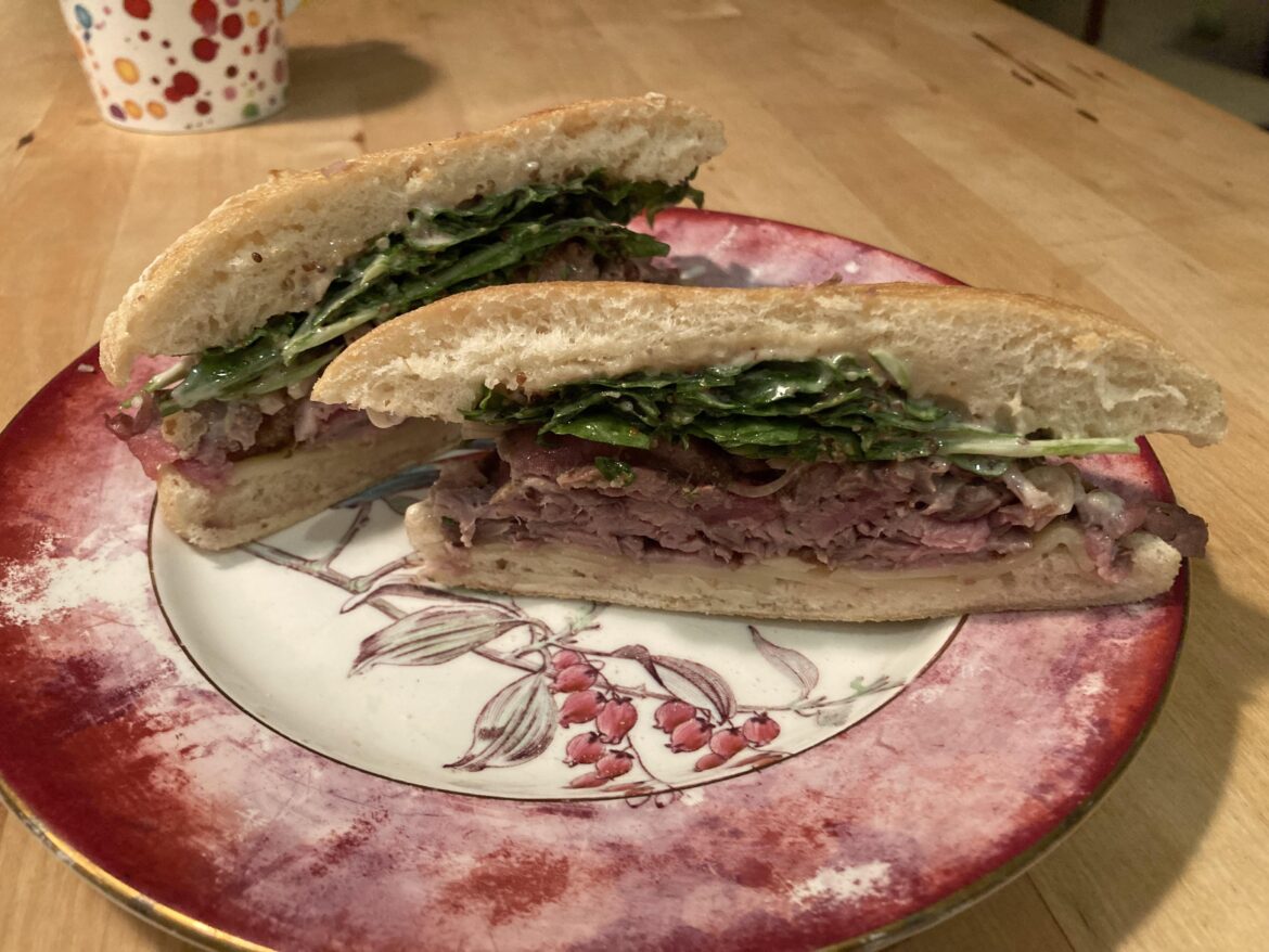 Shaved Ribeye and Striploin, Gruyère, Arugula, Pickled Shallot, Pommery Mustard on Ciabatta
