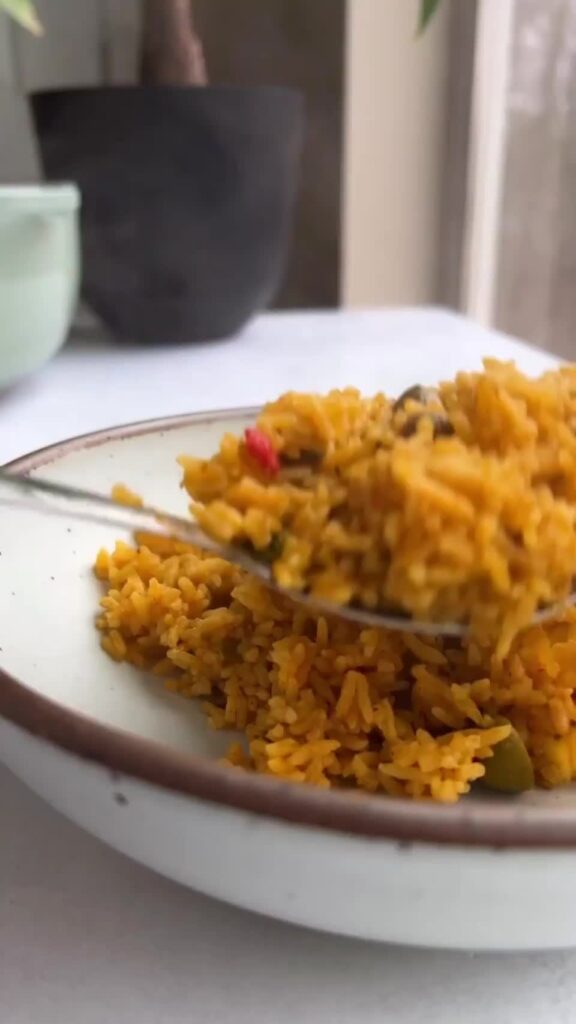 Moro con Coco, a seasoned rice with coconut milk that has an incredible buttery taste