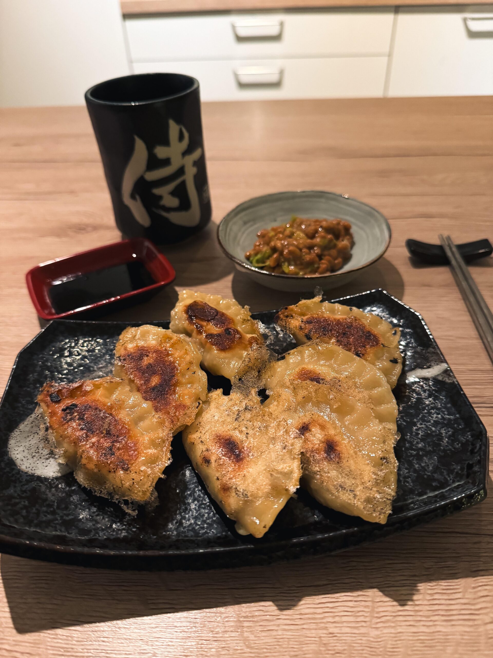 Homemade gyoza (shrimp, shiitake, onion) w/ nattō (topped with shichimi