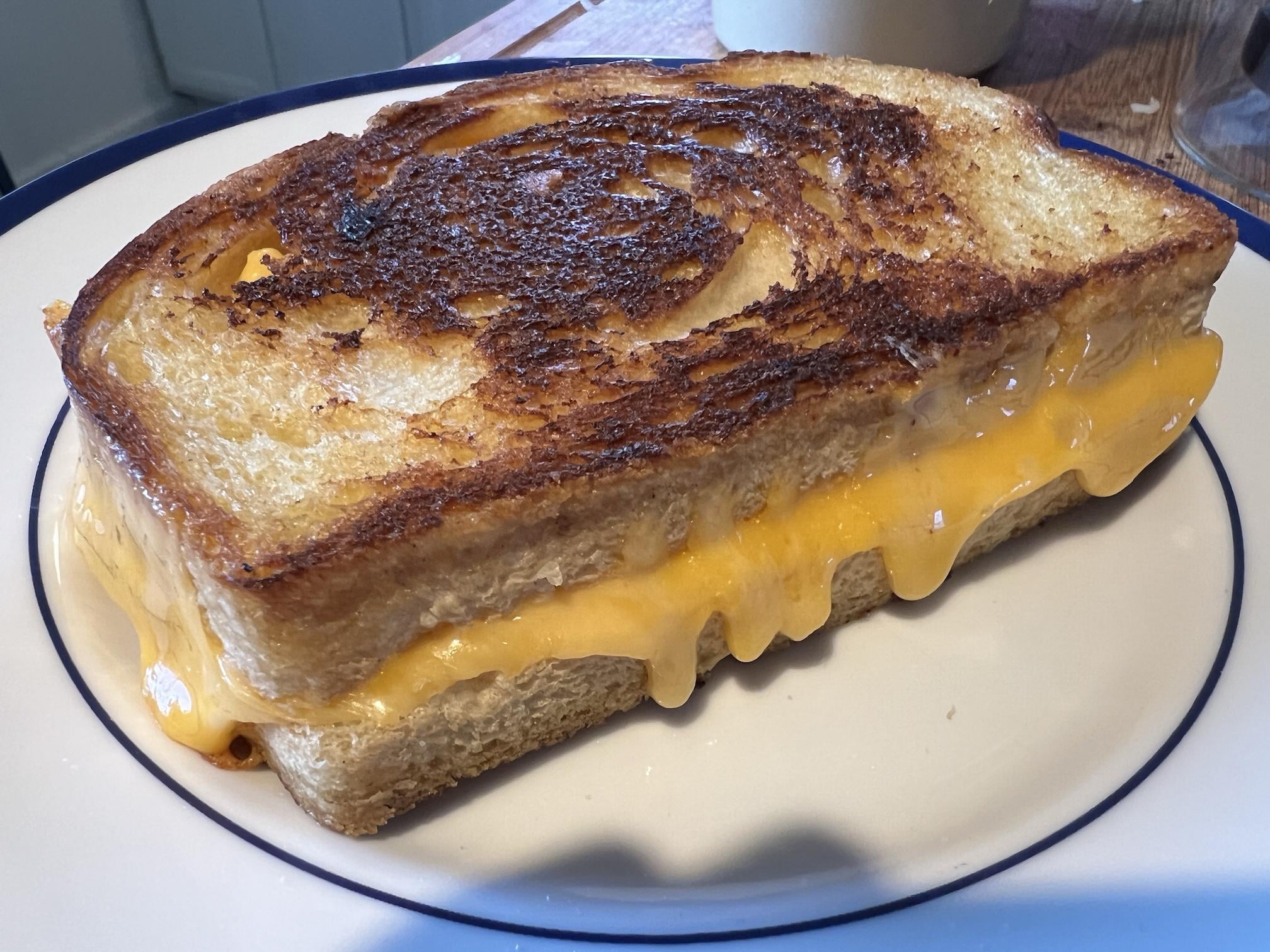 Half sharp cheddar, half Kraft singles, on sourdough Dining and Cooking