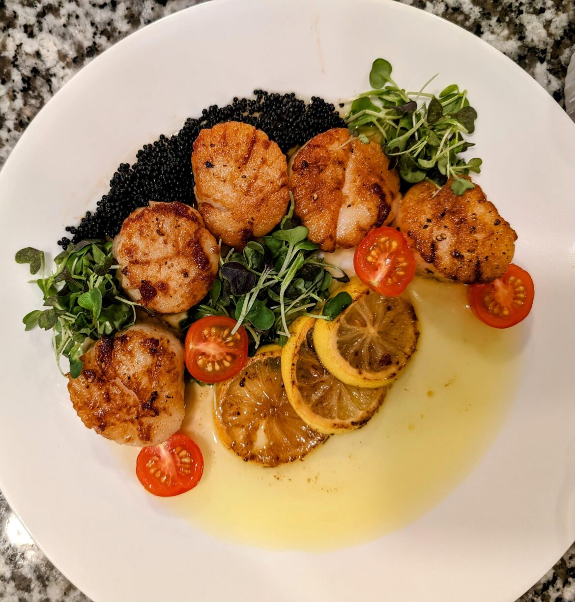 Pan seared scallops with lemon butter sauce and tobiko Pan seared scallops with lemon butter sauce and tobiko