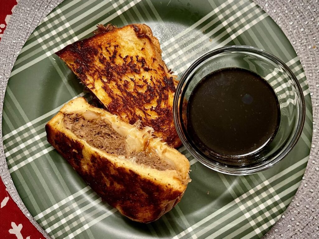 Braised brisket, fried onions, and Gruyere on grilled challah with a side of jus