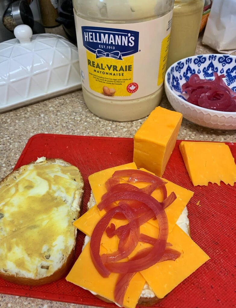 Good old cheddar and pickled onion on buttered seedy loaf with mayo and Dijon mustard.