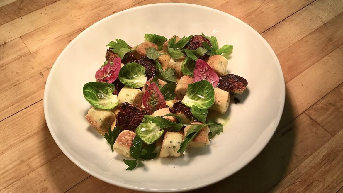 Parisian gnocchi, duck fat brussel sprouts, nasturtium, raw brussel leaves rubbed with lemon oil over butternut squash purée.