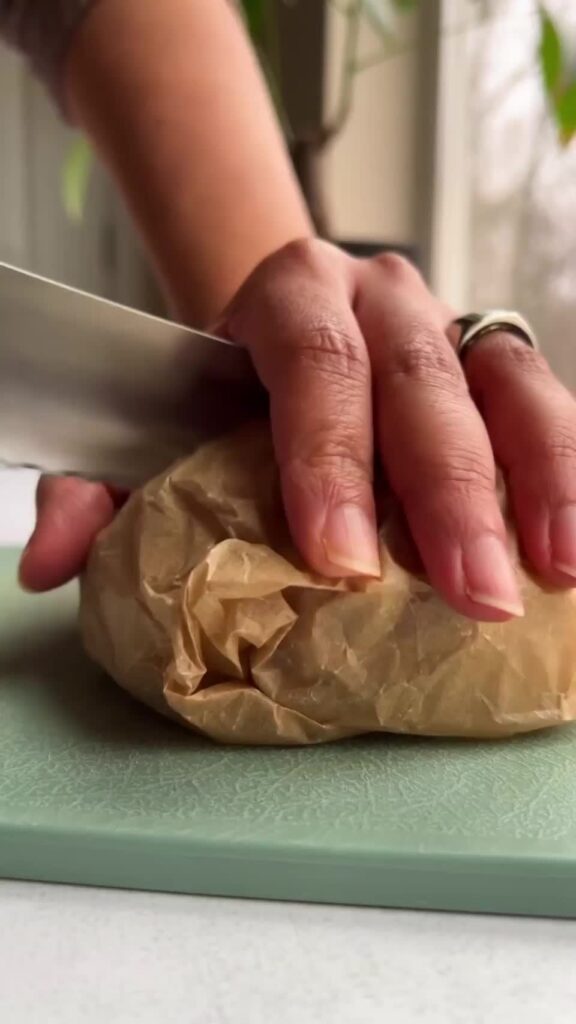 English muffin stuffed with smoky shredded tofu and herby mashed avocado
