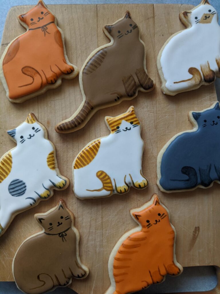 Just two batches of cat themed sugar cookies with royal icing!