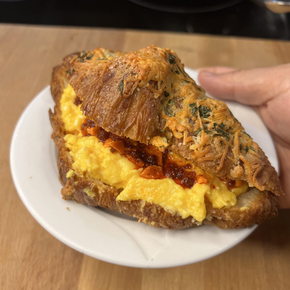 Egg and Chili Crisp on a Garlic Cheese Croissant