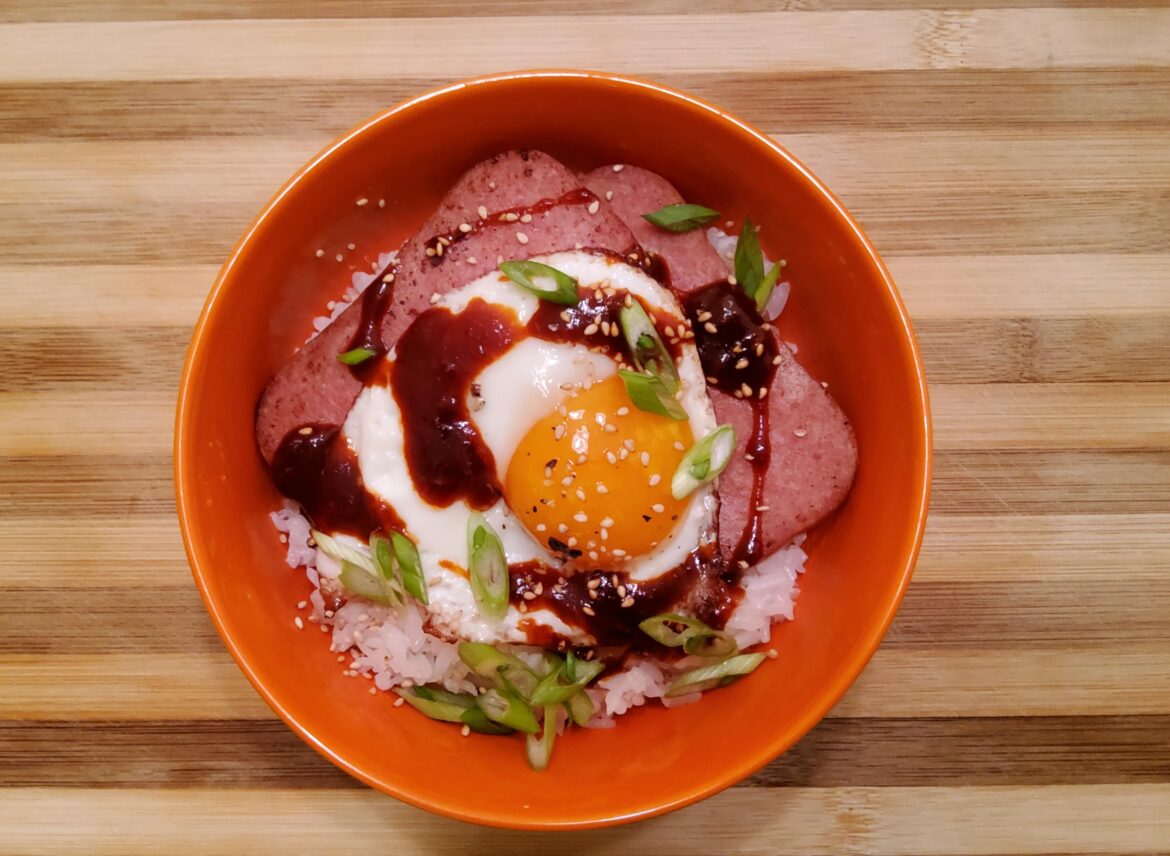 Nothing like hot cooked rice topped with fried spam and fresh egg from your neighbor's backyard hens.