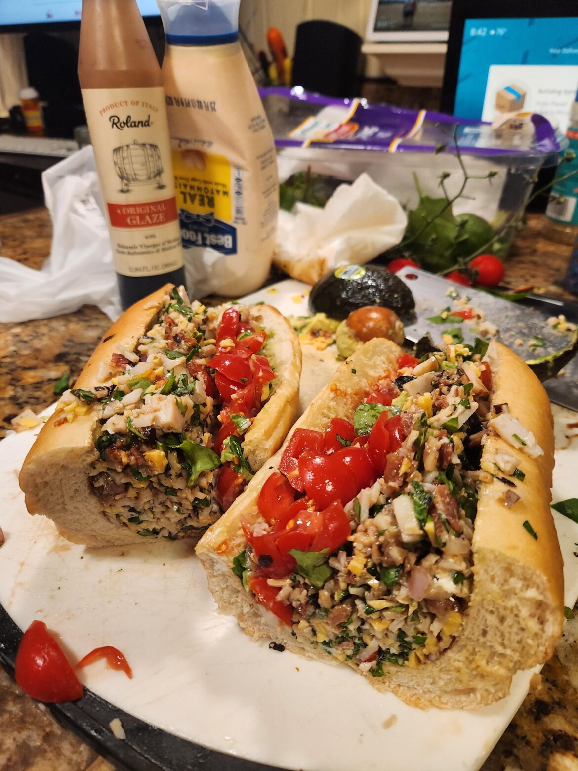 Chopped turkey, bacon, avocado on hoagie roll.