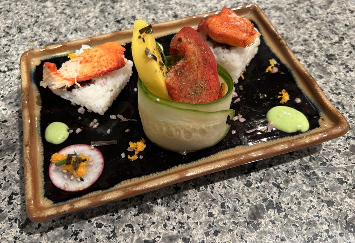 Lobster claw mango sushi (with cucumber wrap, orange zest, shallot, black sesame, nori, radish and wasabi sauce)