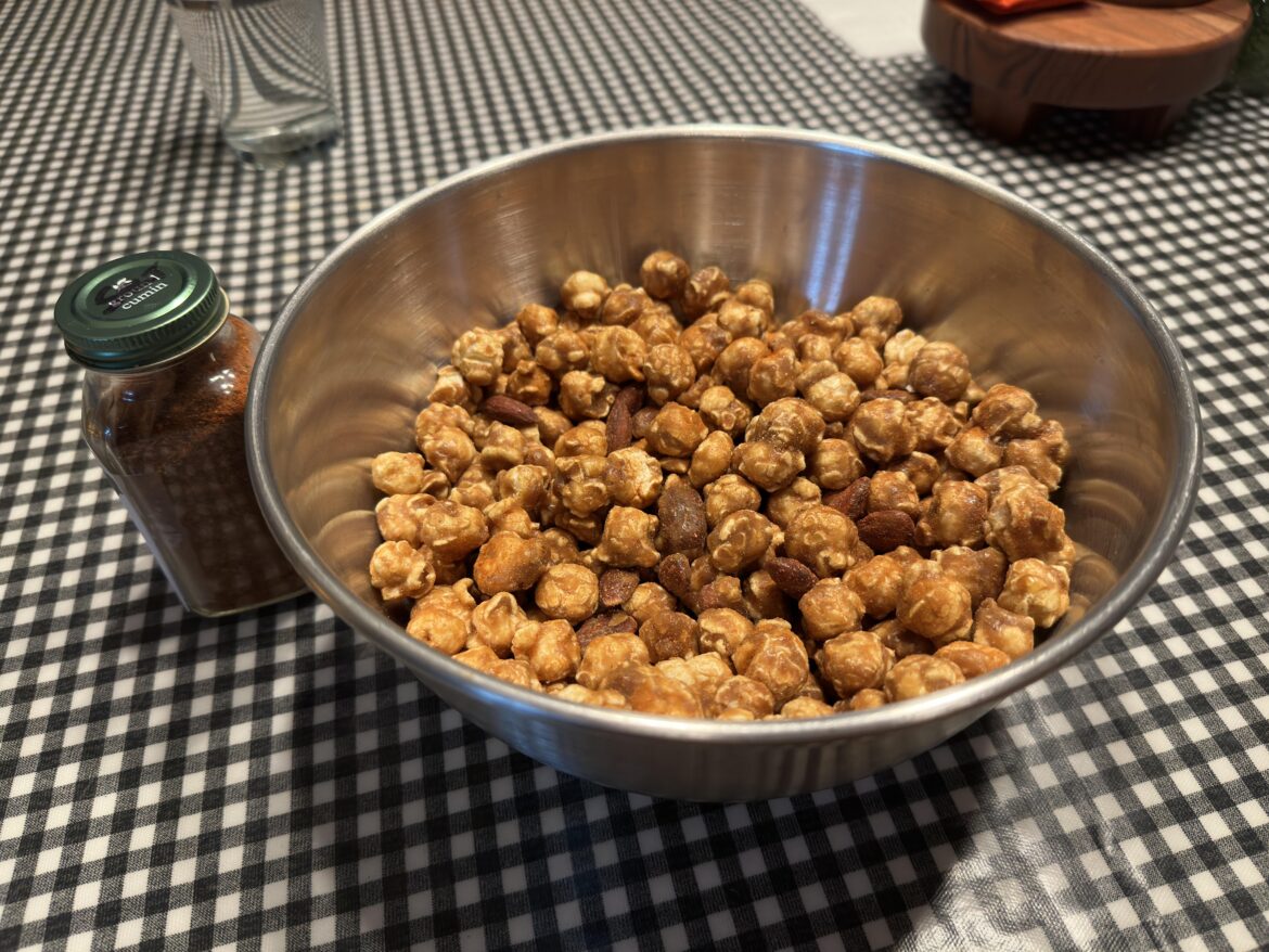 A gift of homegrown pepper powder combined with that no name caramel popcorn in a holiday tin from a gift exchange