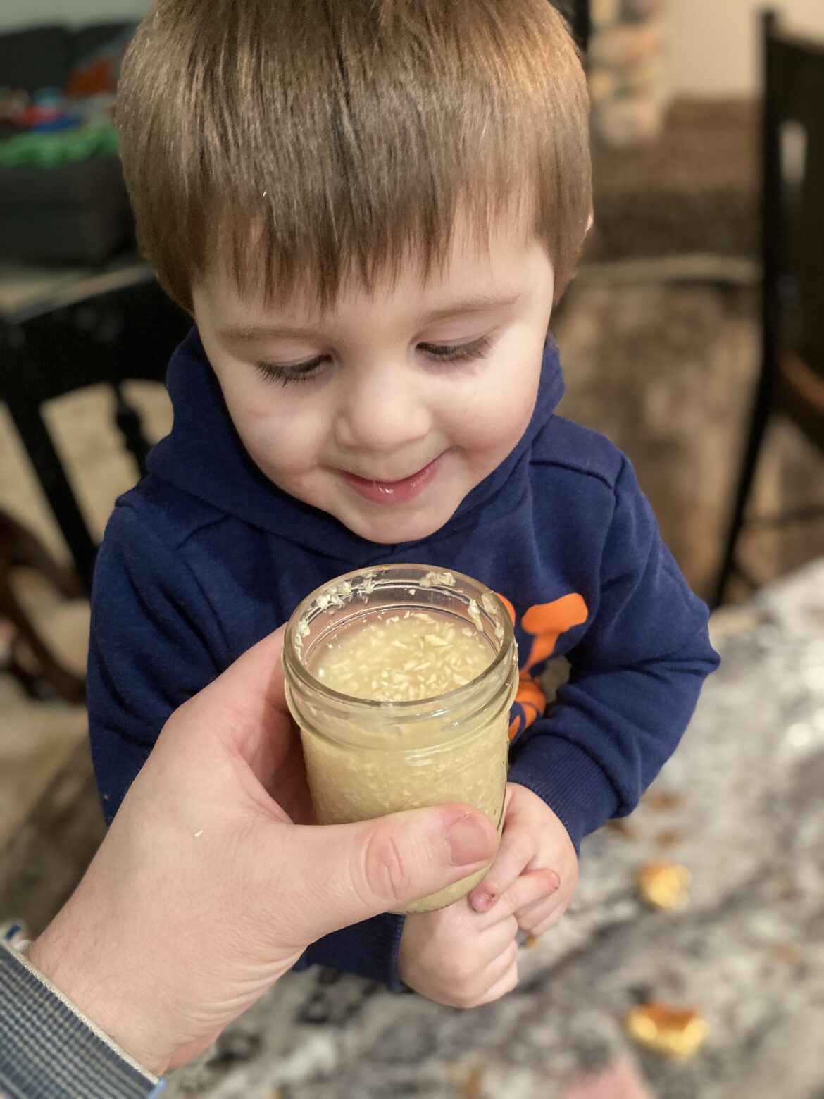 My son and I enjoying the zesty essence of Grandpa’s horseradish, adding a dash of warmth to our Christmas ham creations.