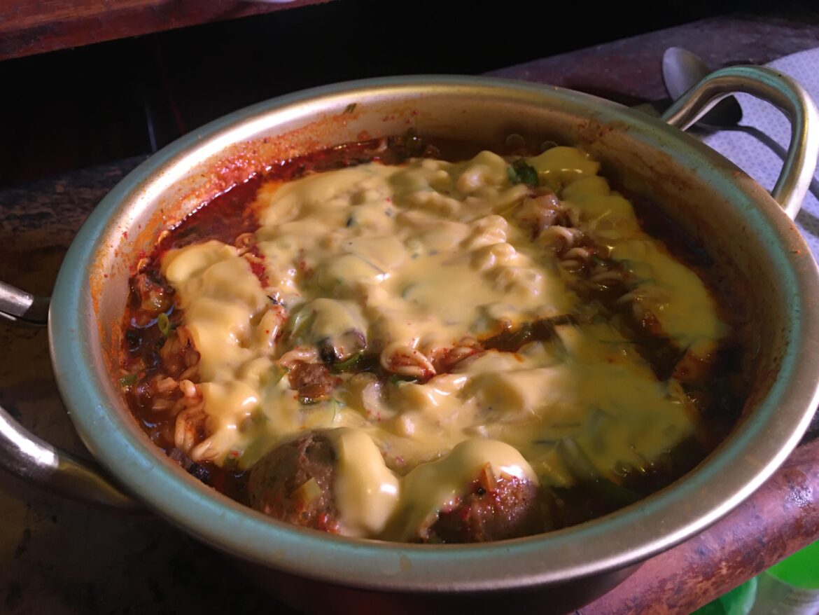 Time for some Buddae Jiggae! Green Onions, Sweet Pepper, Mushrooms, Meatballs, Green Beans, Ramen and Cheese. :)