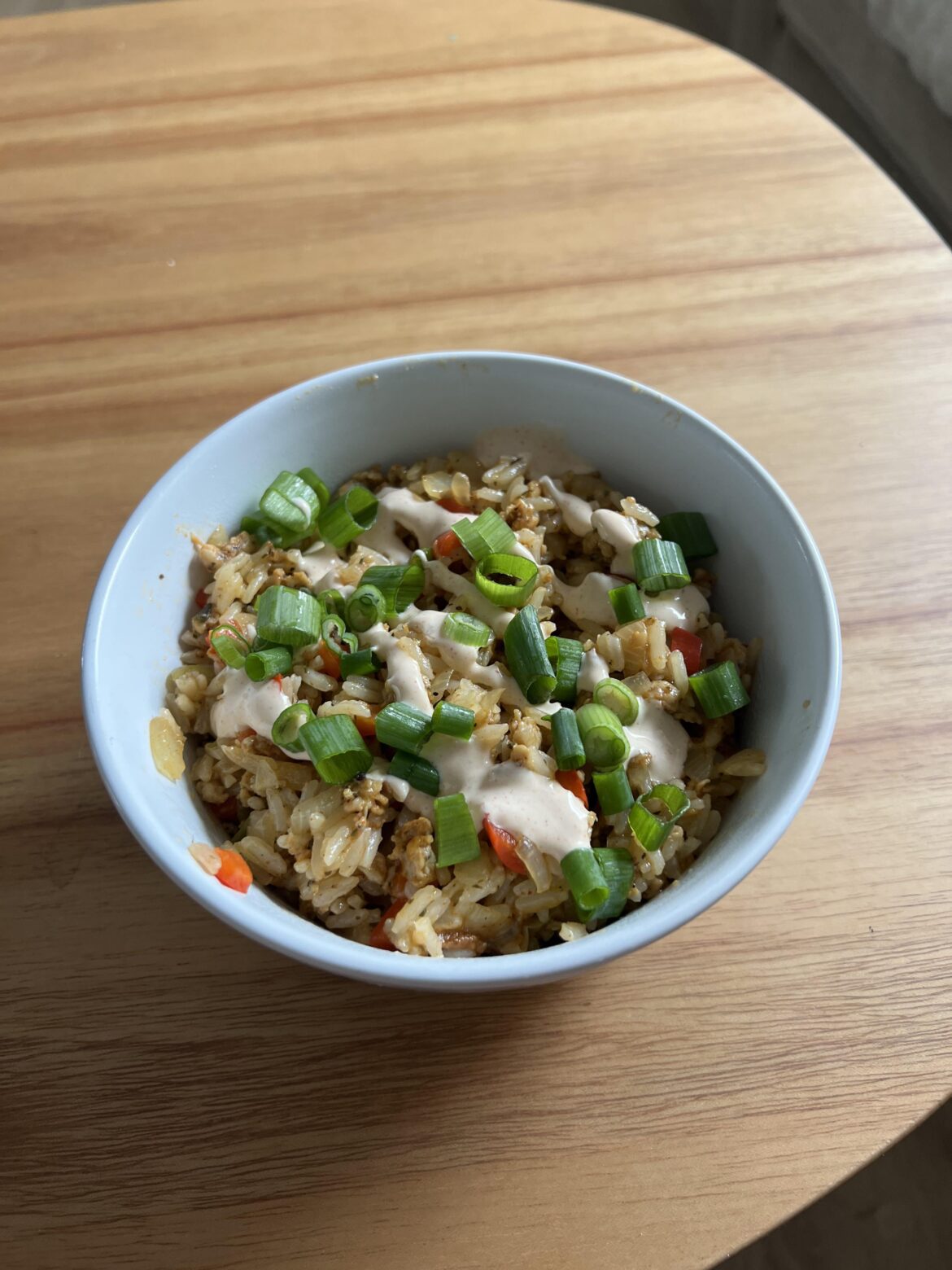 Cajun-Style Chicken Dirty Rice with Smoky Red Pepper Crema