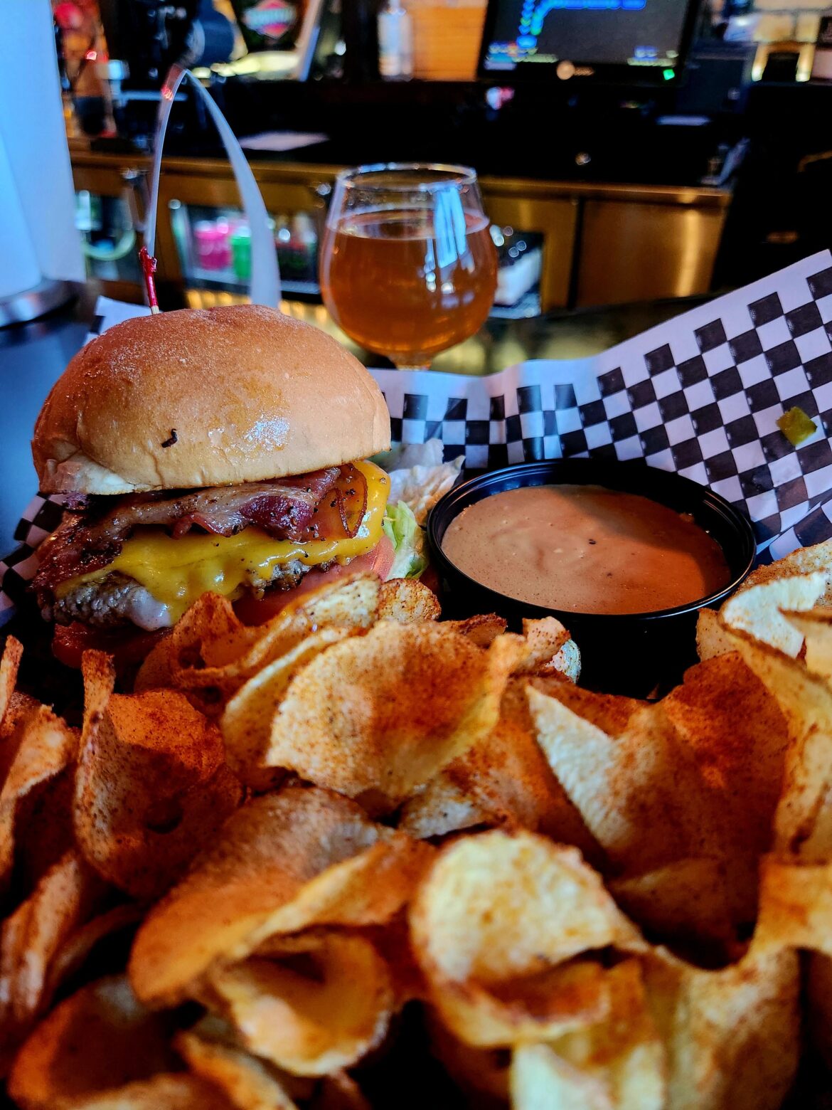 Bacon Cheddarpino Burger with Ghost Pepper Sauce, Cajun Chips and Beer Cheese Sauce.