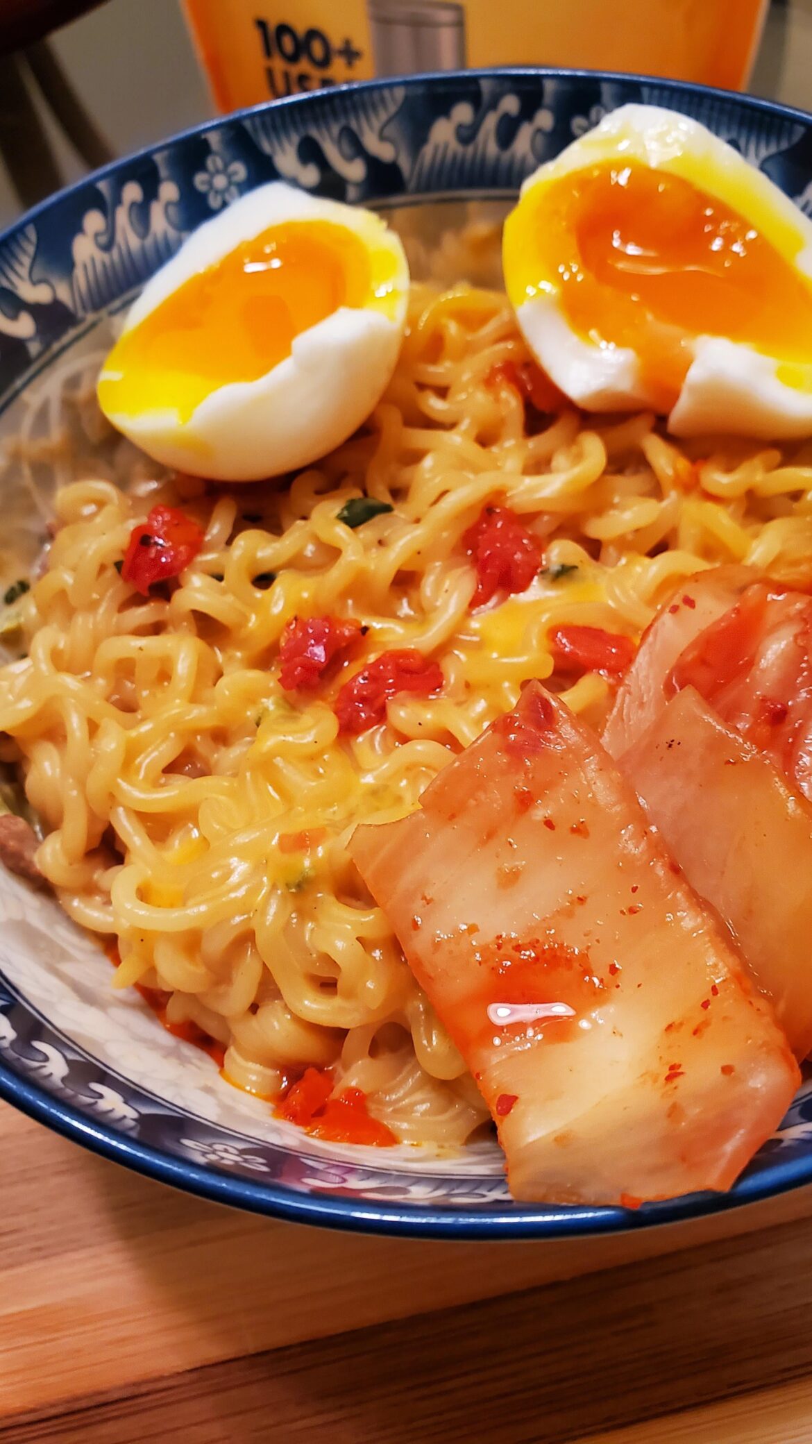 Milk ramen with seasoning packet in the sauce with melted American cheese.
