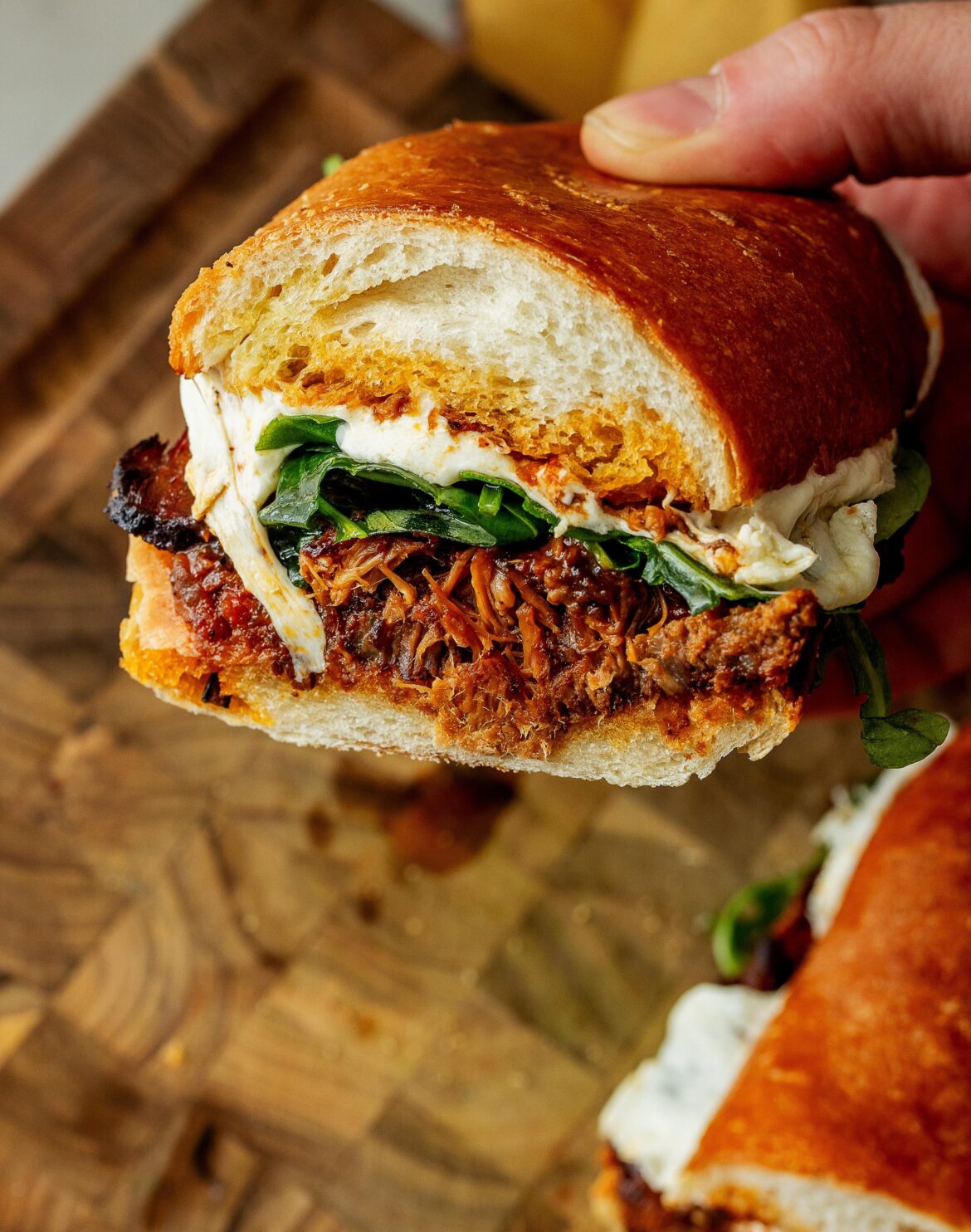 Tuccu Sub! Slow-cooked beef in tomato sauce, mozzarella, arugula, and basil
