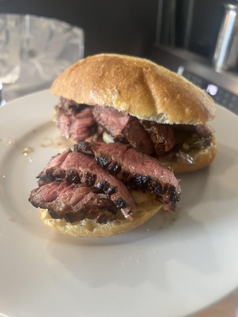 Ribeye sandwich with aioli, salsa made out of shishitos and shallots cooked under the steak to catch up steak juices with 1tbsp of cane sugar, 1tbsp of garlic cilantro balsamic, maldon salt, garlic, steak butter juices, and evoo with fermented peppercorns, and avocado