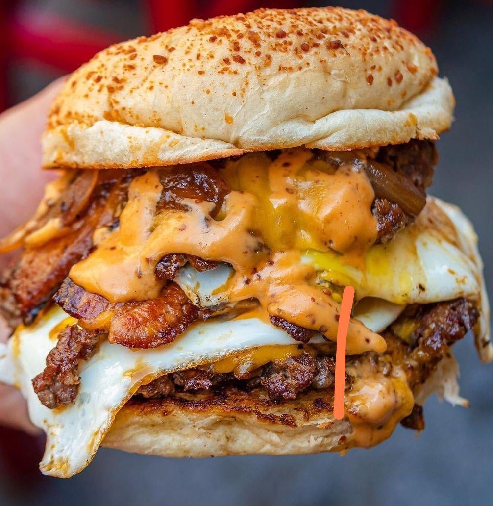 Double beef smash burger, with caramelized onions, fried egg, double