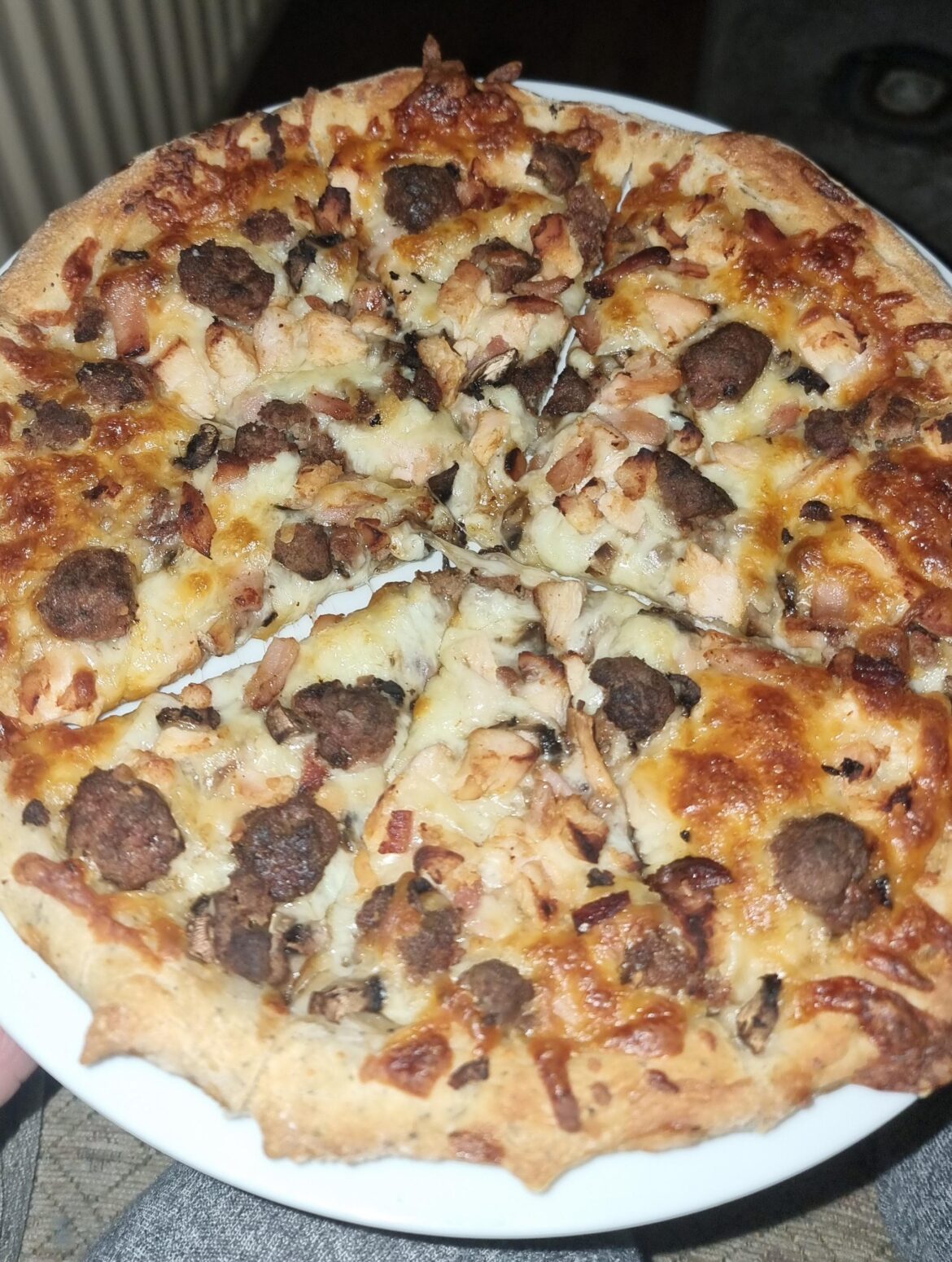 Homemade meat feast pizza