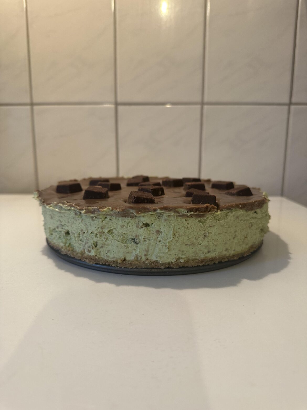 Mint chocolate chip cheesecake topped with mint chocolate sauce and ... Mint chocolate chip cheesecake topped with mint chocolate sauce and ...