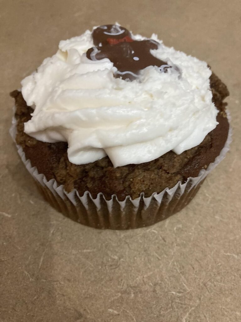 Calorie count for this big gingerbread cupcake? It weighs 202 grams and I think the guy on top is a cookie