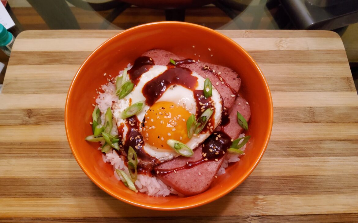 Nothing like hot cooked rice topped with fried spam and fresh egg from your neighbor's backyard hens.