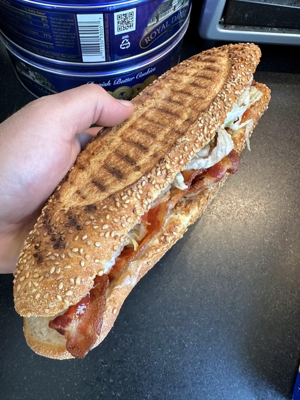 Ham, bacon and Swiss with lettuce, tomatoes, mayo, ketchup, salt, pepper, oil and vinegar.