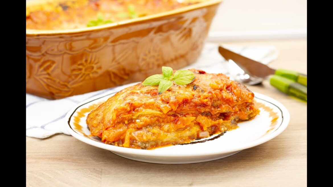 Eggplant Parmigiana with tomato sauce and cheese. This Italian dish is the perfect comfort food.