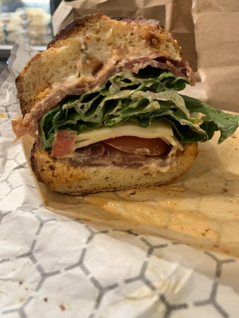 Prosciutto and cappy on semolina bread with red pepper relish and garlic mayo