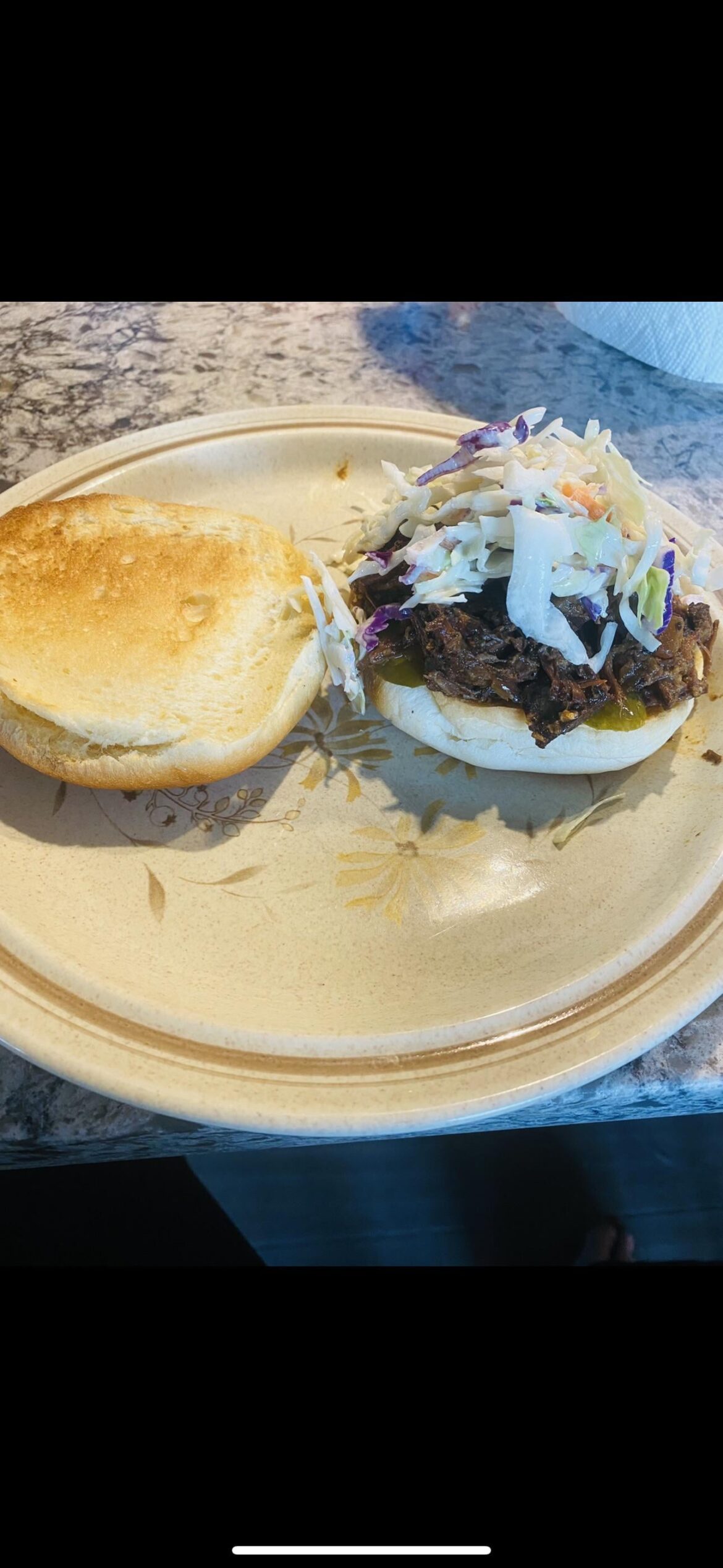 Smoked brisket, pickles, coleslaw, mayo and hotsauce on the bottom