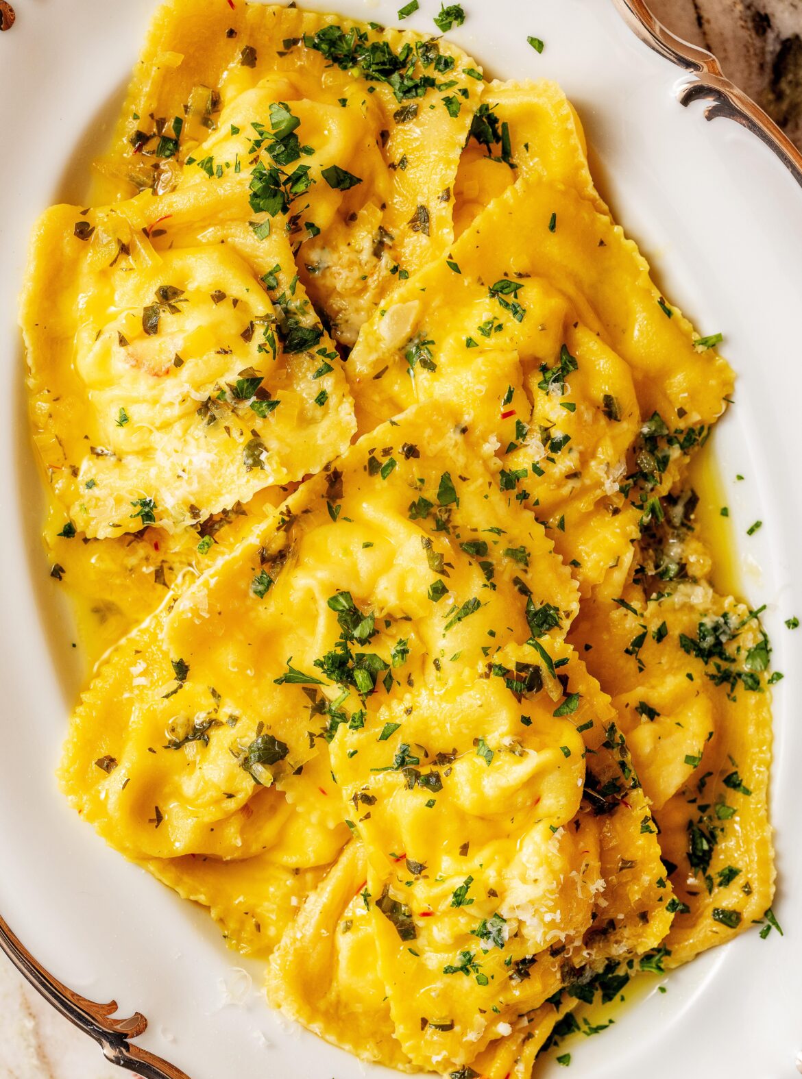 Homemade lobster ravioli with saffron sauce for NYE