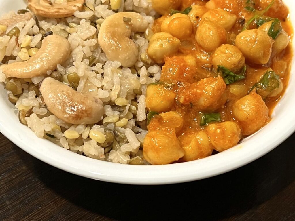 Basmati rice cooked with skin-on mung beans and cashews ; served with curried chickpeas.