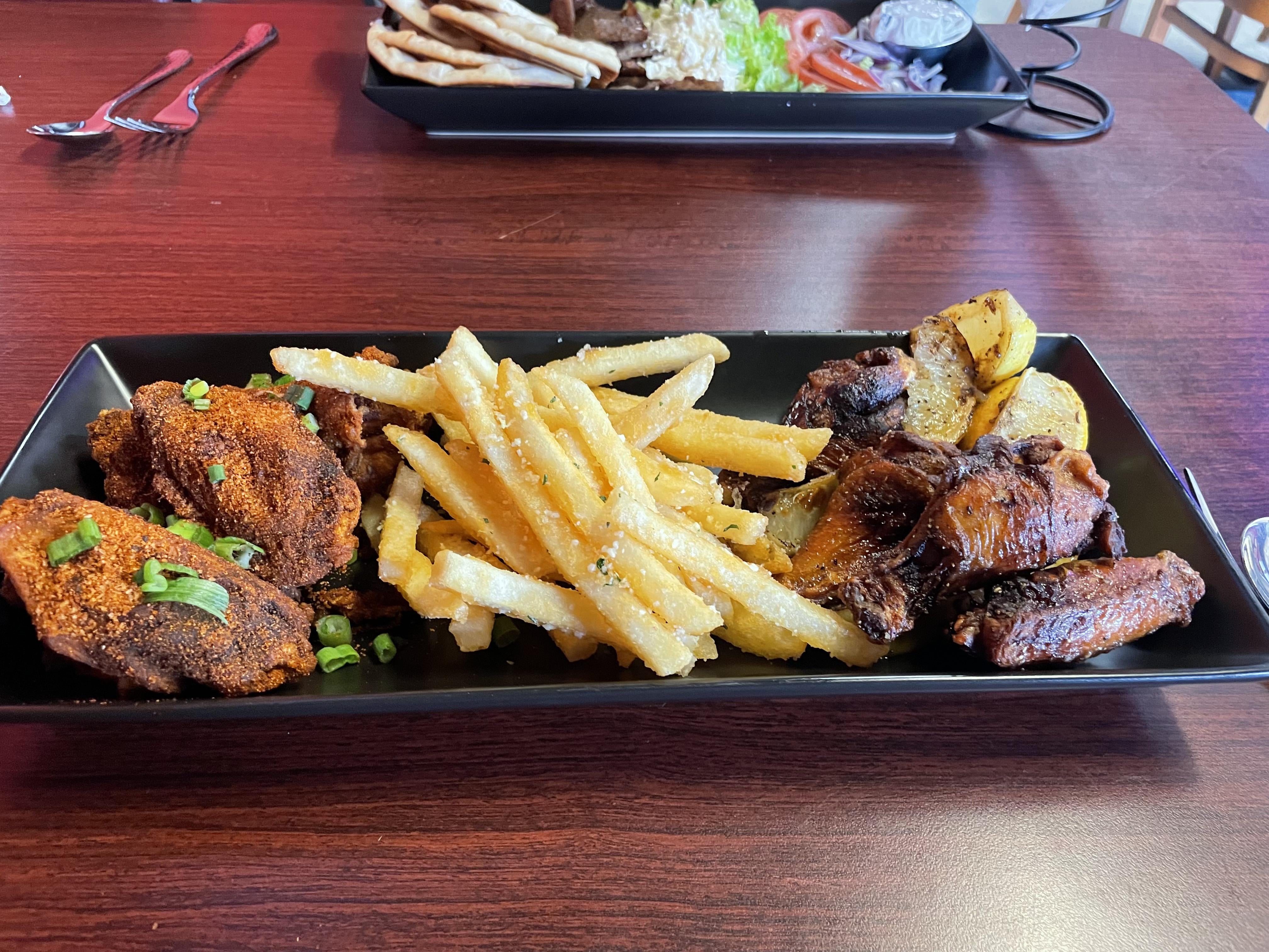 Cajun and wet lemon pepper wings injected with black garlic butter at Pho King Wings in Colorado