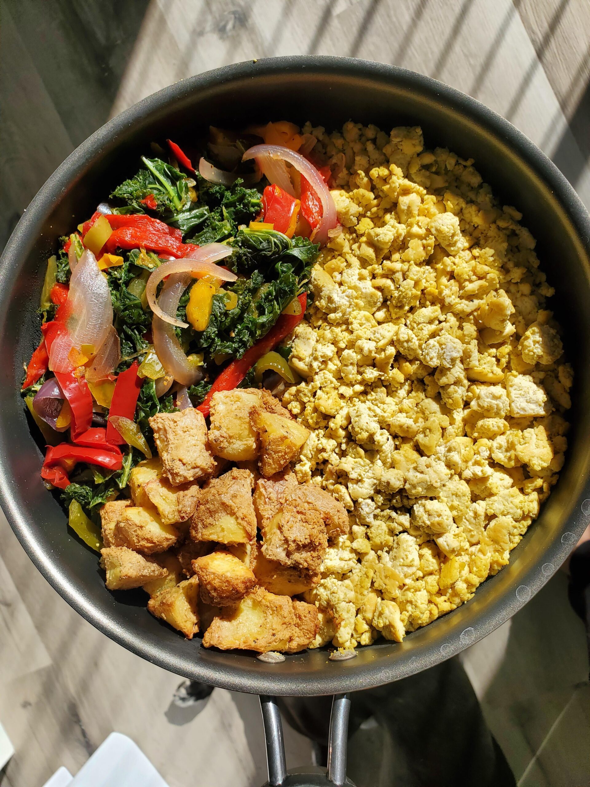 Tofu scramble w/ seasoned potatoes, kale, onions, and peppers! Dining
