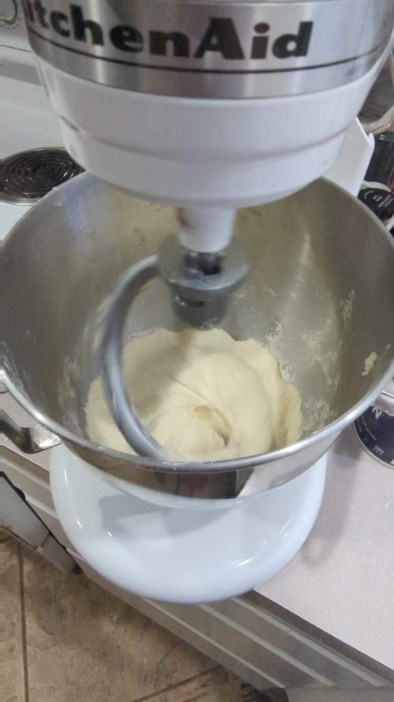 Dough is doing this instead of sticking to dough hook. Any advice?