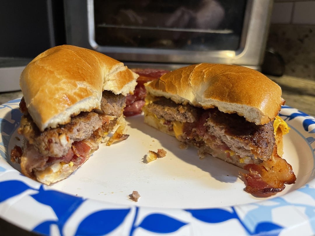 Sausage, bacon, egg, and cheese on a plain bagel. Dining and Cooking