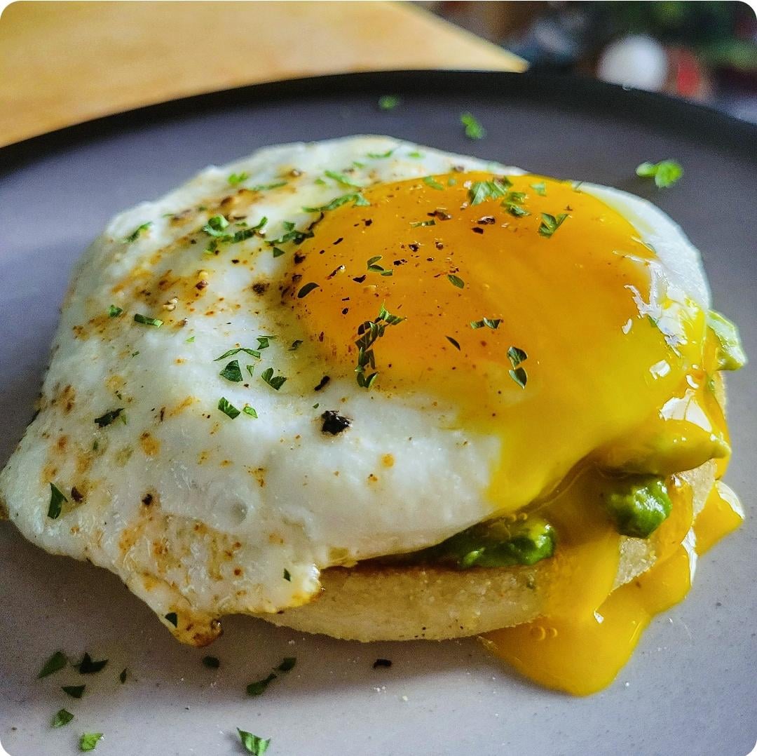 Butter toasted english muffin with avocado mash and of course...the egg